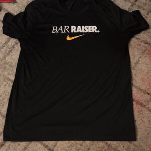 Nike Black Short Sleeve 'BAR RAISER' Tee with Gold Swoosh